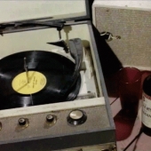 Retro record player and a bottle of wine