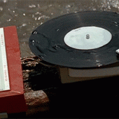 Old school record player by the water