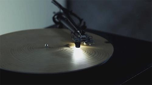 Record player plays slices of wood