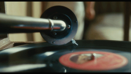 Phonograph, dancing in the background