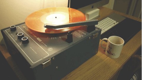 Vintage record player by a coffee